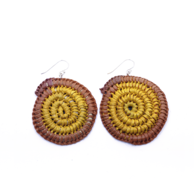 Photograph of a pair of circular gunga (natural weaving) earrings with silver findings. the Earrings are yellow in the centre and natural purple around the outside